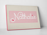 The name "Nathalie" in a special font and design printed on canvas. 